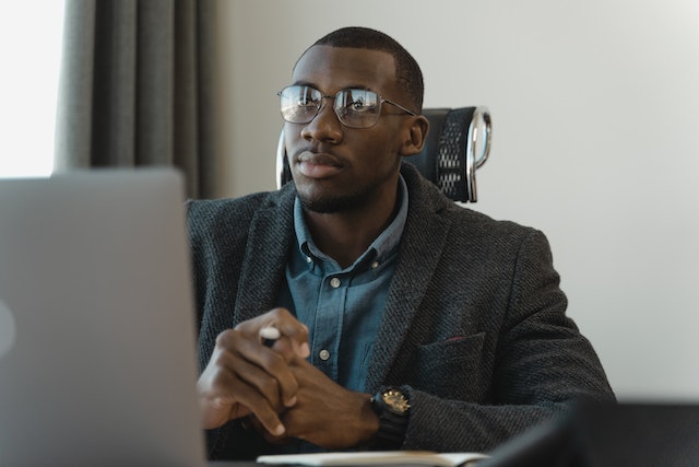 property manager sitting at their desk looking at their computer